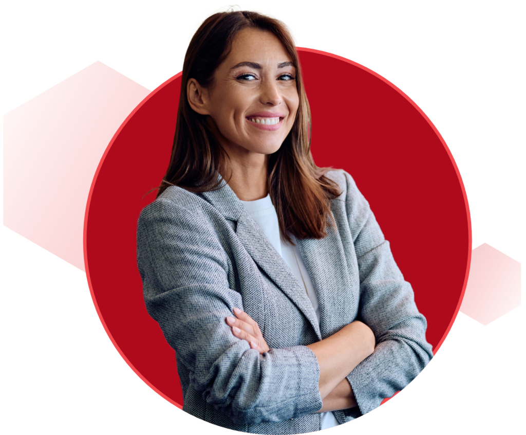 A professional woman in a business suit stands confidently before a large red circle, symbolizing focus and determination.